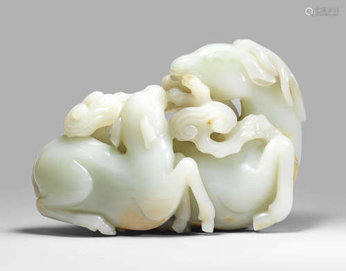 A magnificent large very pale green jade 'stag and young' group Qianlong