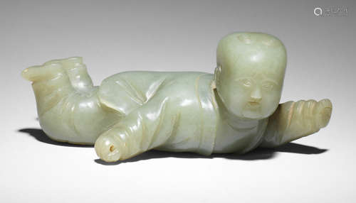 A rare large green and russet jade 'boy' brush rest 17th century