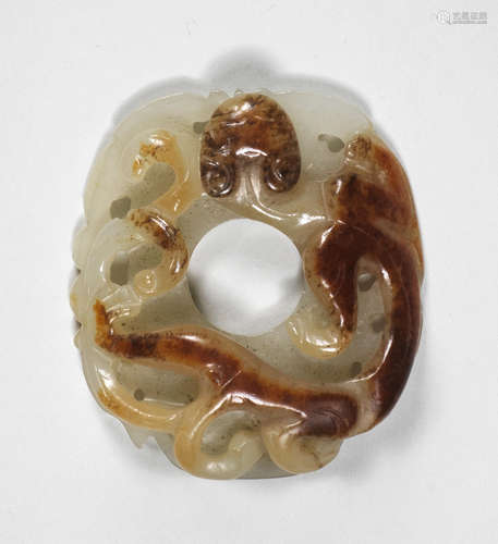 A rare archaistic white and russet jade She-shaped pendant Probably Song/Yuan Dynasty