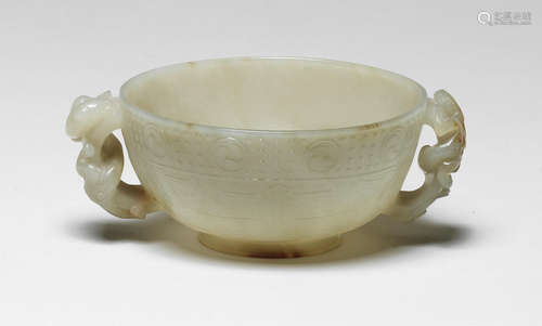 A rare pale green and russet jade chilong-handled cup Ming Dynasty