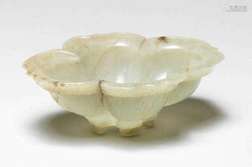 A rare pale green jade quatrelobed 'lotus' shaped brush washer 17th century