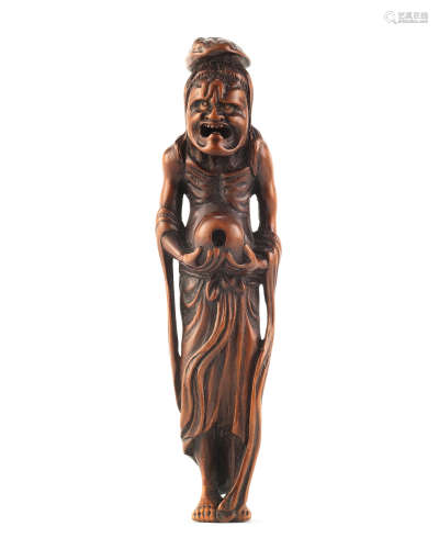 A Tall wood netsuke of Ryujin's assistant Edo period (1615-1868), late 18th/early 19th century