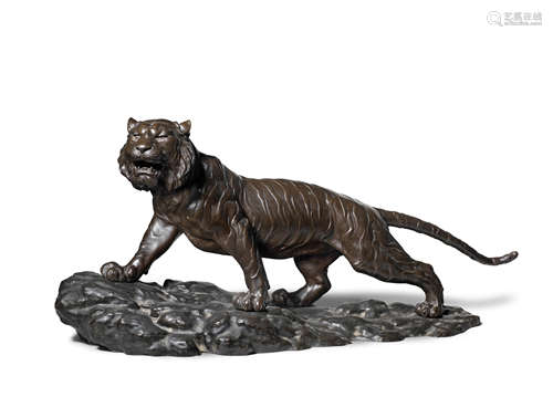 A massive bronze okimono of a prowling tiger on an en-suite bronze stand By Takahashi Ryoun, Meiji era (1868-1912), late 19th/early 20th century