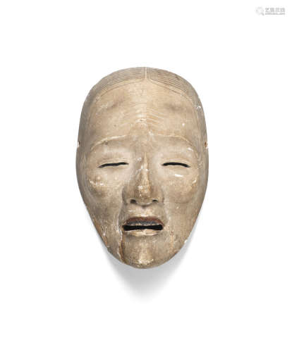 A carved wood Noh mask By a member of the Echizen Deme lineage, Edo period (1615-1868), late 18th/early 19th century