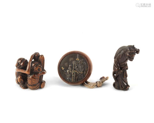 Three wood netsuke and one stag-antler kiseruzutsu (pipe case) Edo period (1615-1868), early to late 19th century