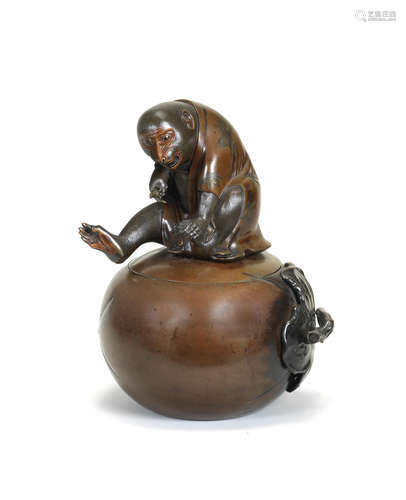 A bronze large vessel and cover in the form of a monkey perched on top of a persimmon fruit Meiji era (1868-1912), late 19th/early 20th century