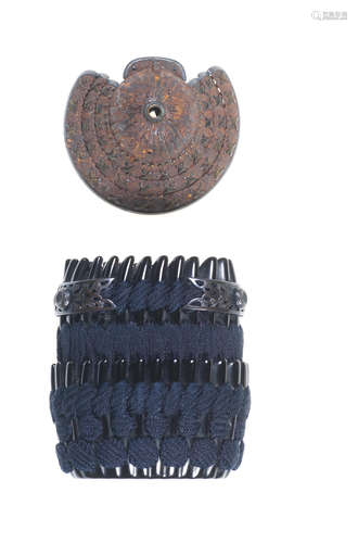 A lacquered kinchaku (pouch) and iron netsuke in the form of a kabuto (helmet) The kinchaku by Shigeyoshi; both pieces Edo period (1615-1868), 19th century