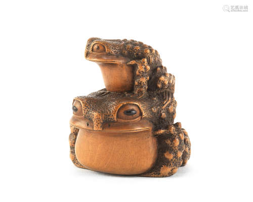 A wood netsuke of two toads By Masanao, Yamada, Ise Province, Edo period (1615-1868), 19th century