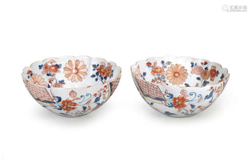 A pair of Imari bowls and an Imari 'sleeve' vase Edo period (1615-1868), the bowls late 17th/early 18th century, the vase late 18th century