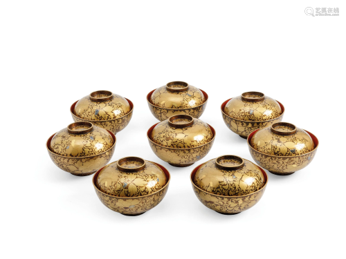 EIGHT BLACK AND GOLD LAQUER RICE BOWLS …