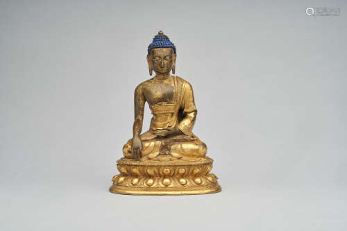 A gilt-bronze figure of Shakyamuni Buddha  Kangxi period