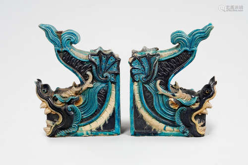 A pair of turquoise and aubergine glazed pottery chiwen roof fragments  Ming dynasty