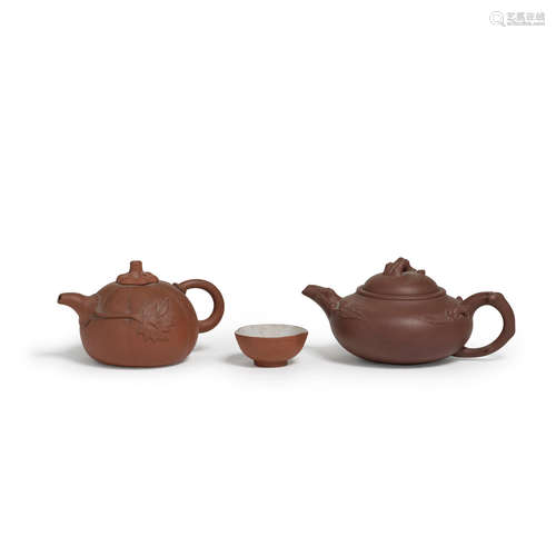 Two yixing teapots and a cup  20th century