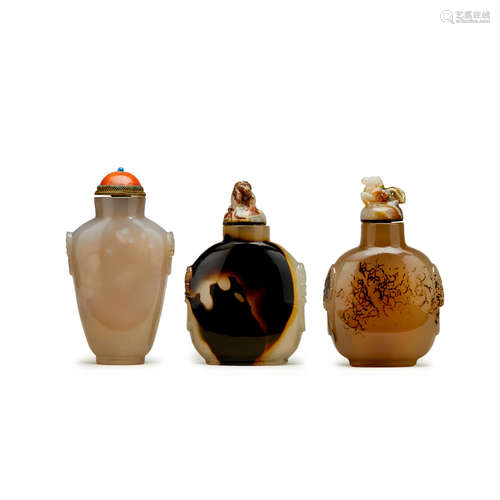 Three agate snuff bottles surmounted with faux lion mask handles