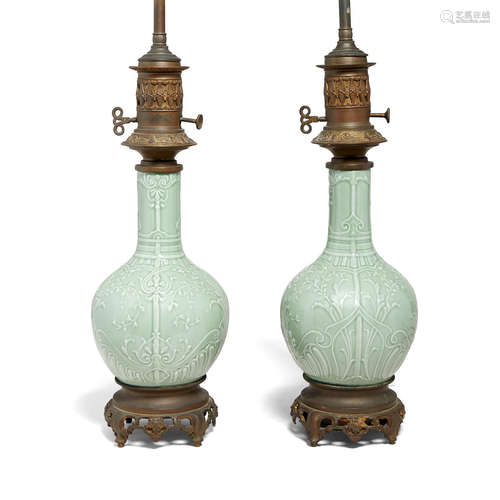 A pair of celadon glazed stick neck vases  19th century