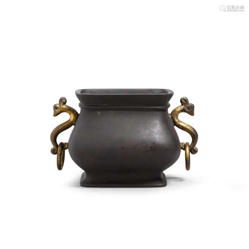 A bronze square-sectioned incense burner