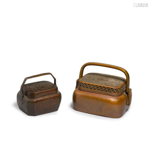 A group of two metal handwarmers  19th century