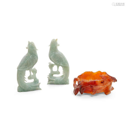 A pair of jadeite phoenixes and a carved carnelian bowl