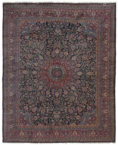 KIRMAN CARPET with vegetal decoration on a red bac…