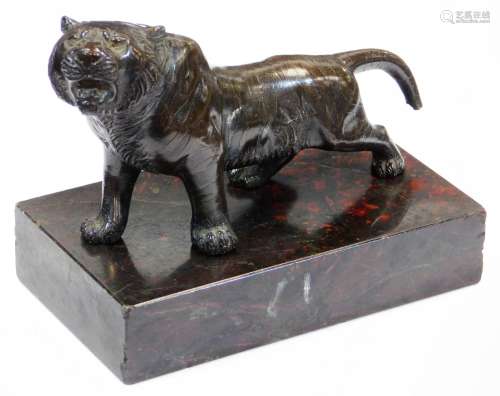 A Japanese bronze model of a snarling tiger, the body with stripes in low relief, associated base,