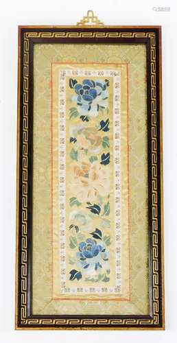 An early 20thC Chinese silk work, of rectangular form, set with flowers with an outer floral border,