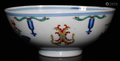 A Chinese porcelain bowl, of circular form, polychrome decorated with a geometric floral pattern,