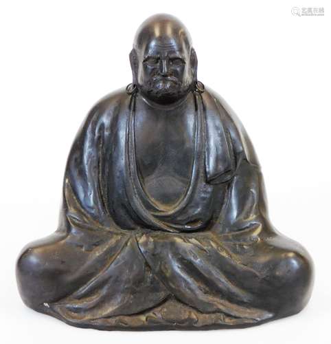 A Japanese bronze figure of seated Daruma in mediation, signed Teruun to the side above seal 