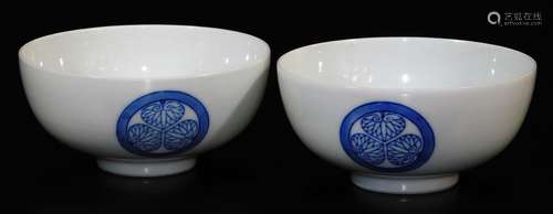 A pair of Japanese porcelain bowls, decorated with Aio (Tokugawa) mon, the base marked 