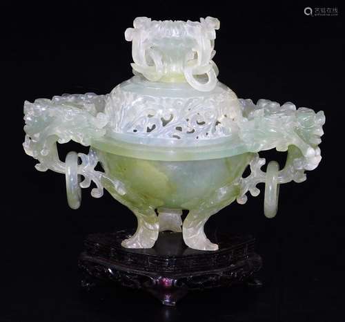 A Chinese green hard stone censer with pierced cover, set with rings and scrolls and flowers, the