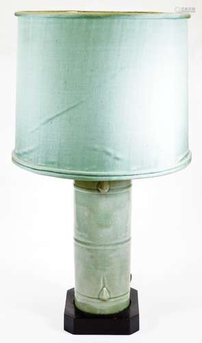 A 20thC Chinese celadon lamp, shaped as a section of bamboo, on a canted wood base with shade and