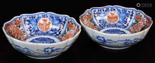 A pair of lobed Japanese porcelain Imari bowls, decorated in typical red, orange, green and
