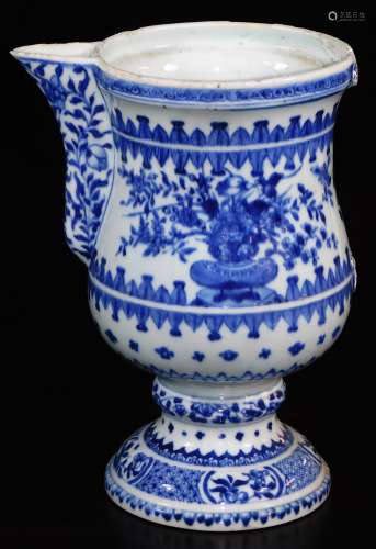 A 18thC blue and white porcelain ewer, with shaped spout, bellied circular body, inverted stem and
