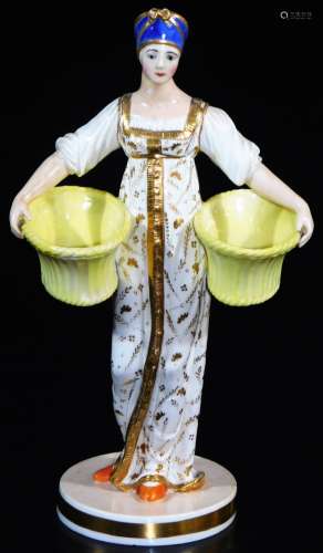 A Russian Gardner double salt figure, formed as a lady in flowing robes holding yellow salts, on a