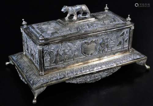 An early 20thC Indian ceremonial freedom casket, of rectangular form with tiger knop, urn finials