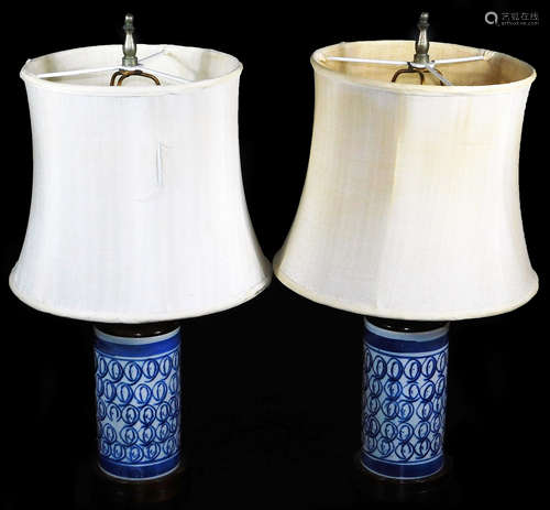 A pair of Chinese porcelain vases, with wooden mounts, decorated with a repeat geometric pattern,