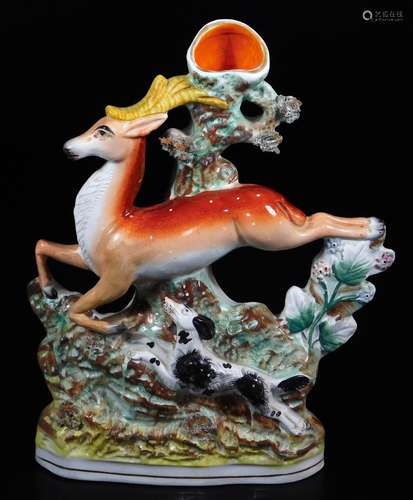 A 19thC Staffordshire flat back spill vase, formed as a dog chasing deer, polychrome decorated