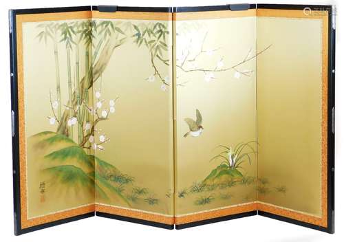 A 20thC four fold table Japanese screen, decorated with birds among prunus and bamboo, signed,