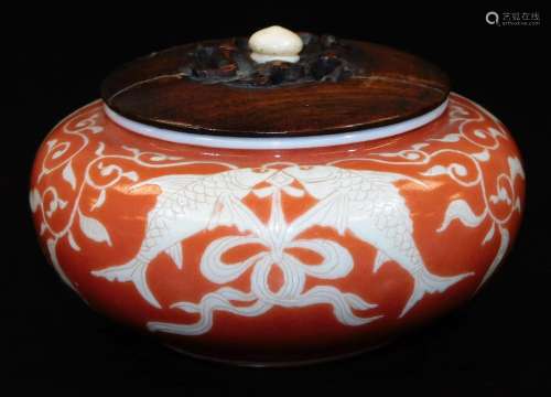A Japanese porcelain koro, with original wood cover, decorated in coral and pale yellow enamel, with