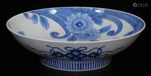 A large Japanese porcelain underglaze blue and white Nabeshima dish, decorated with stylised peonies