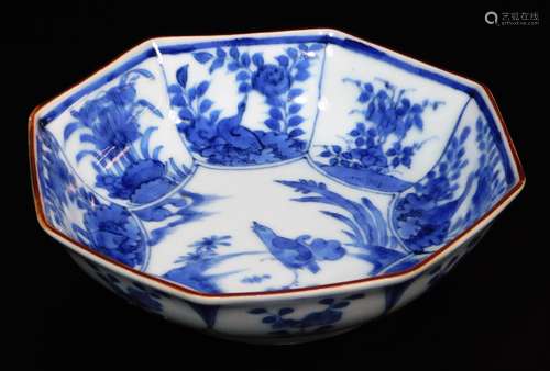 A fine Japanese Arita blue and white octagonal porcelain dish, decorated with a central panel of a