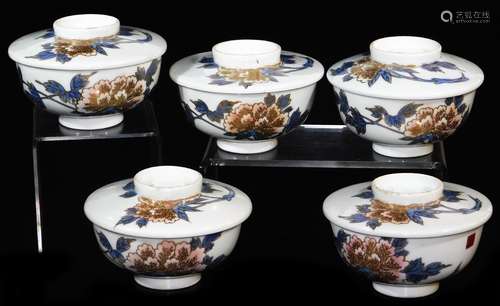 A set of five similar Japanese porcelain bowls and covers, decorated blue, peach and gold with