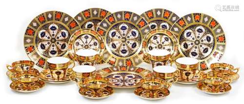 A comprehensive Royal Crown Derby Imari pattern part service, comprising six 26cm diameter plates,