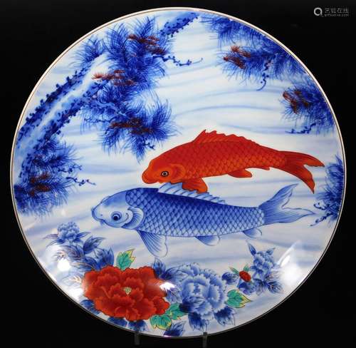 A 20thC Japanese porcelain charger, of circular form, decorated with fish and flowers, predominantly