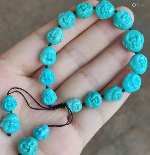 A TURQUOISE MAITREYA PATTERN BRACELET