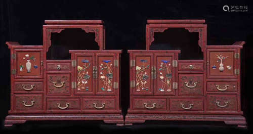 A RED LACQUER CABINET WITH LOTUS PATTERN