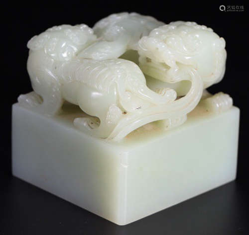 A LION PATTERN HETIAN JADE CARVED SEAL WITH ZITAN WOOD BOX