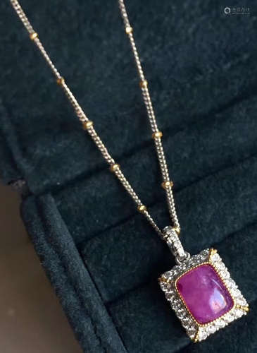 A 18K GOLD SUGILITE DIAMOND PENDANT