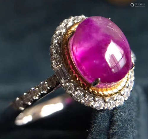 A 18K GOLD SUGILITE DIAMOND RING