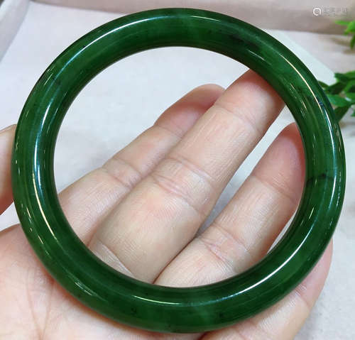 A JASPER CARVED BANGLE