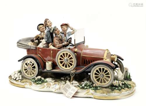 A large Veteran motoring porcelain figural group by Capodimonte, Italian,